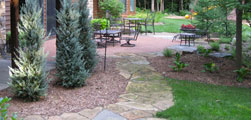 Flagstone pathways and water features dominate this Landscape Solutions design